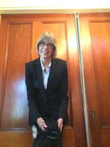 My name is Julie Wesolowski. Woman in black pantsuit with dog.