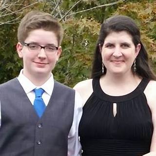 jennifer-and-son-black-dress-vest-and-glasses