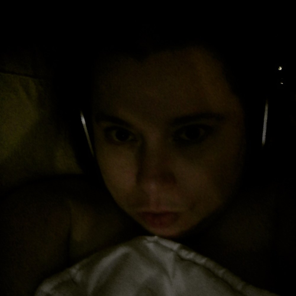 me-in-bed-wearing-headphones-because-of-my-illnesses
