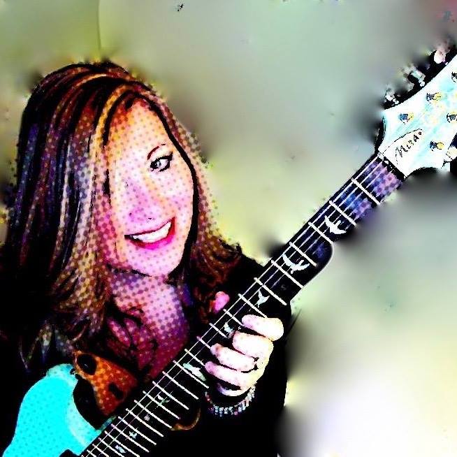 pixelated-pic-of-blonde-haired-woman-holding-a-light-blue-guitar